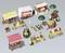 Several small stalls and stands in miniature format, including market stands with awnings, tables with food, and decorative umbrellas.