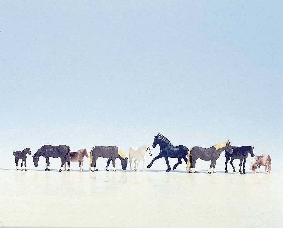 'Miniature figurines of 10 horses in various sizes and colours stand in a straight line against a light blue background.'