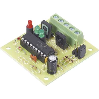 A green circuit board with electronic components such as light-emitting diodes, a black chip, and a capacitor.