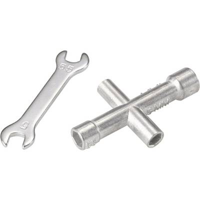 A silver adjustable spanner and a cross wrench are lying side by side on a white surface.