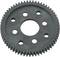 A black gear wheel with six evenly distributed holes. It is likely used in machines or mechanical systems.