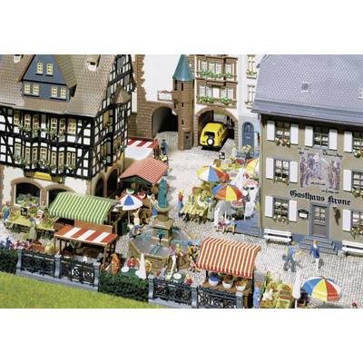 A bustling street scene in an old town, with half-timbered houses, cafés with colourful parasols, and people strolling leisurely.