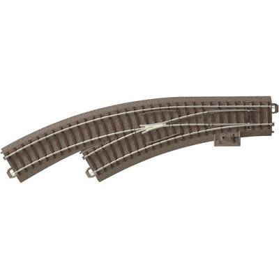 Two curved model railway tracks that branch into a points at one point.