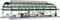 A model of a historic railway station with a green glass canopy, multiple platforms, and signs. It is intricately designed.