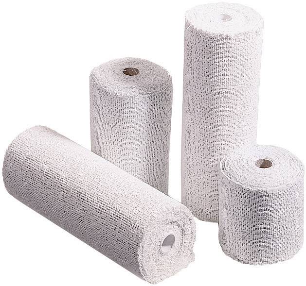 Four white, rolled-up bandage rolls of different sizes on a light background.