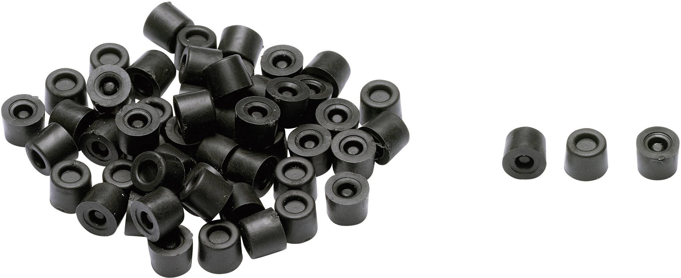 Black, cylindrical rubber feet. A collection on the left, three positioned separately on the right. Used for protection or dampening.