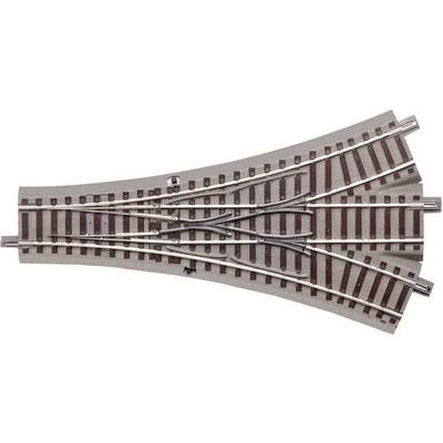 Metal and plastic railway point showing parallel track lines, enabling direction changes for model trains.