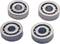 Four silver ball bearings in close-up, evenly arranged, show the details of the bearing construction.