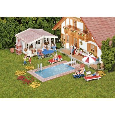 A model scene featuring a house, swimming pool, and people relaxing and playing in the garden. Deck chairs, parasols, and plants are visible.