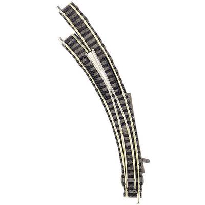 A curved model railway point with two tracks that split into a straight and a diverging line.