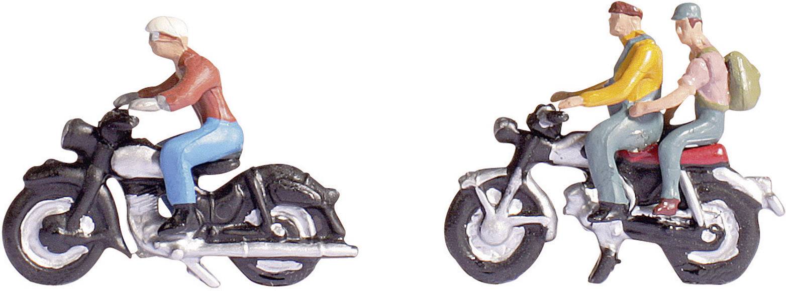 Two miniature figures on motorcycles; a single person on a motorbike on the left, two people on a motorbike on the right, one wearing a rucksack.