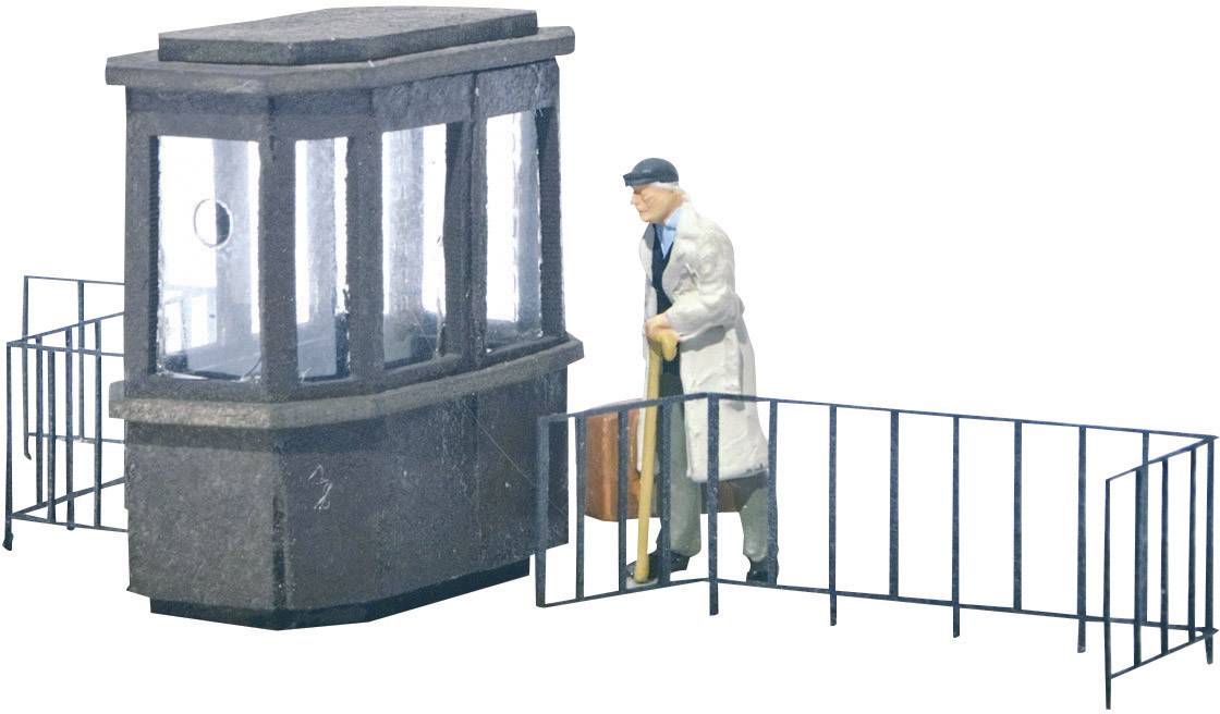 A miniature night watchman with a lantern stands beside a sentry box.