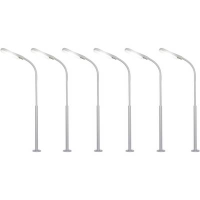 Five similar street lamps in a row, all shining brightly.