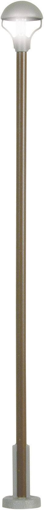 A tall street lamp with a round, white light head and a long, brown column anchored in a grey base.