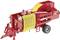 A red agricultural machine with yellow details on two wheels, likely used for crop processing or hay baling.