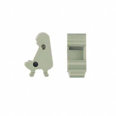 Two grey plastic parts with different shapes, one resembling a bird, the other rectangular.