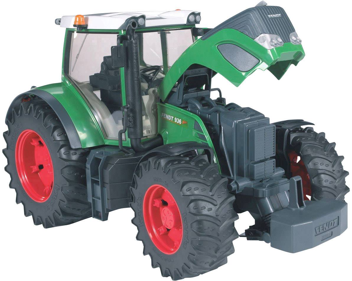 A green toy tractor with red tyres and an open bonnet revealing its engine. The tractor is intricately designed.