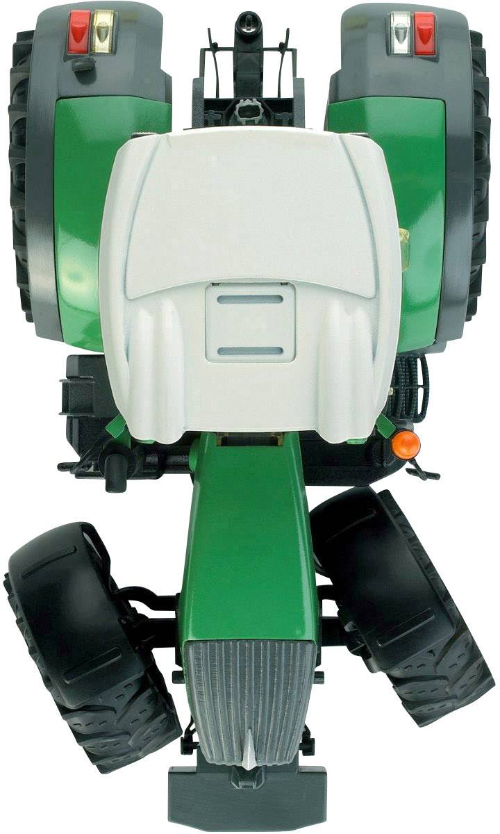 A green toy tractor photographed from above, showing details such as tyres and driver's cab in the centre of the image.