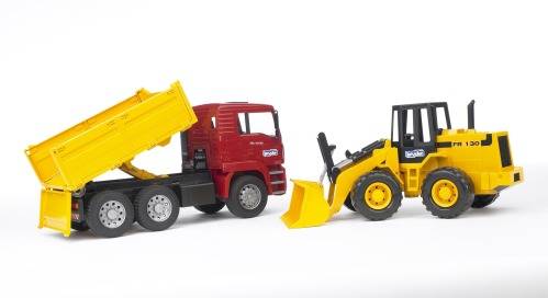 A red toy lorry with a yellow cargo bed is parked next to a yellow toy construction vehicle with a shovel.