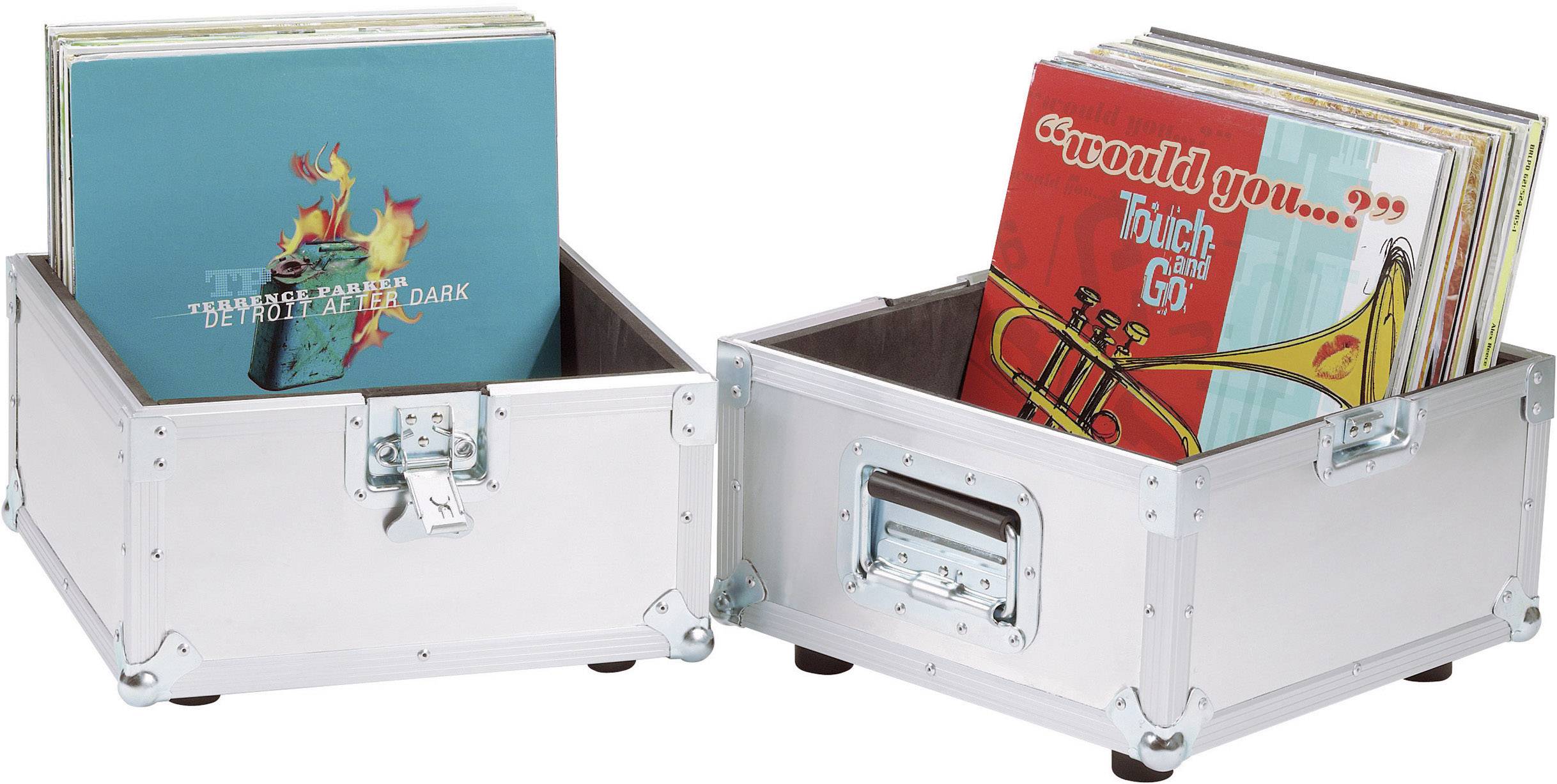 Two silver boxes with vinyl records. The left box contains albums, the right one displays a cover with a trumpet design and the text 'would you... Touch and Go'.