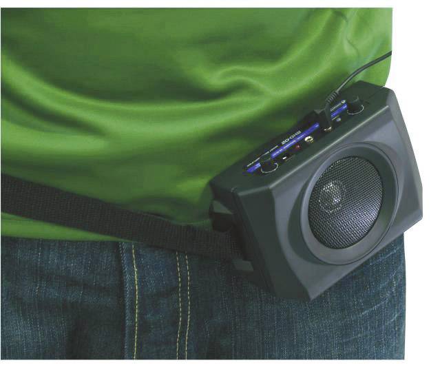 A person is wearing a portable speaker on their belt. The speaker is black and has numerous control buttons on the top.