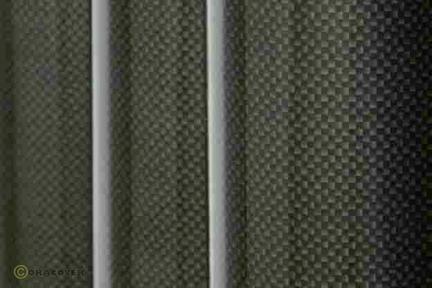 Close-up of a structured surface with a uniform chequered pattern in dark grey tones, possibly carbon fibre.