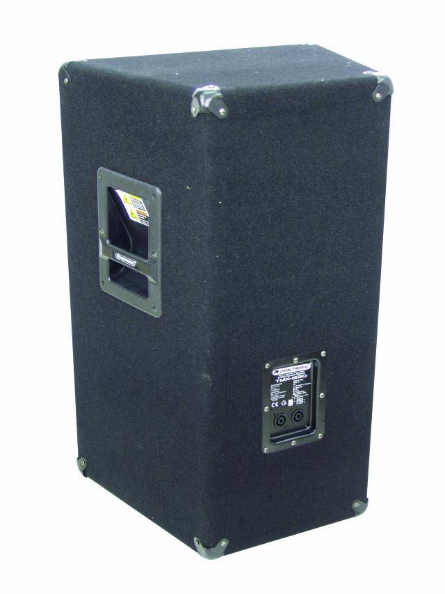 A black, rectangular speaker with a handle on the side; the back shows connection sockets and a nameplate.