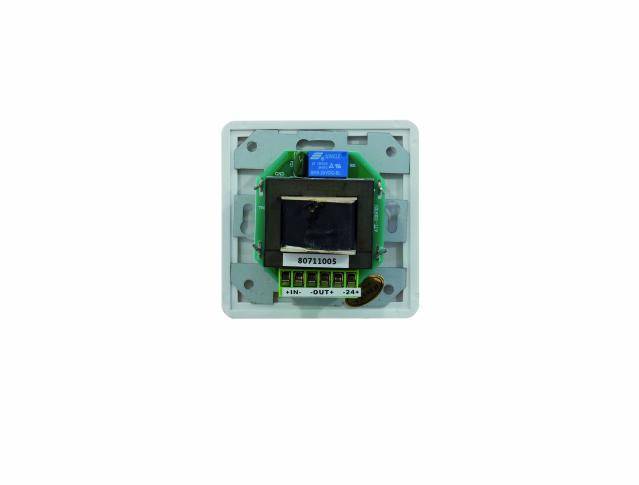 A green electronic circuit board on a white base with a black component in the centre and blue labelling at the top.