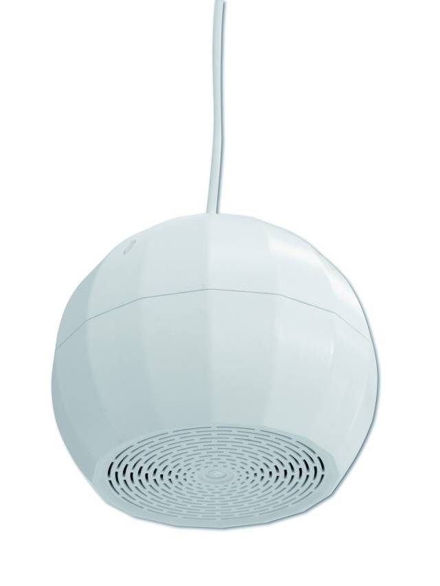 A round, white ceiling speaker with a ventilation grille at the bottom and a cable at the top is hanging from the ceiling.