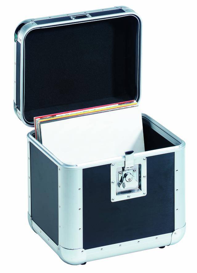 An open black suitcase with silver edges contains several vinyl records.