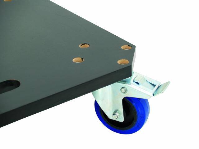 A black plate with holes at the corners is mounted on a blue wheel with a metal bracket.