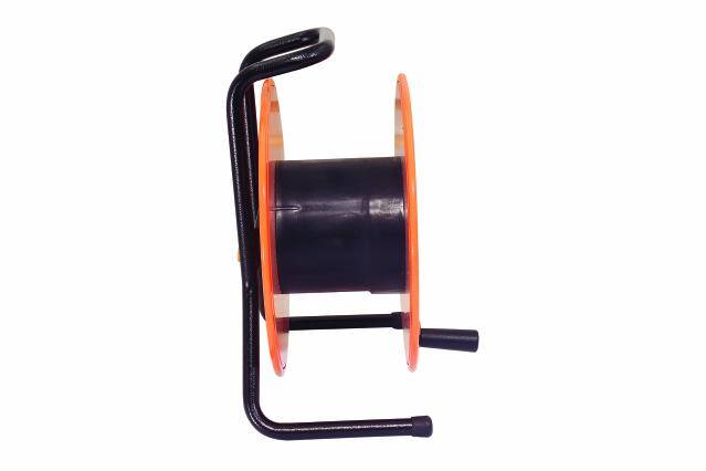 An empty cable drum viewed from the side. Suitable for winding long cables or lines on construction sites or in the garden.