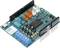 'An Arduino motor shield with blue, orange, and black connectors and multiple electronic components.'