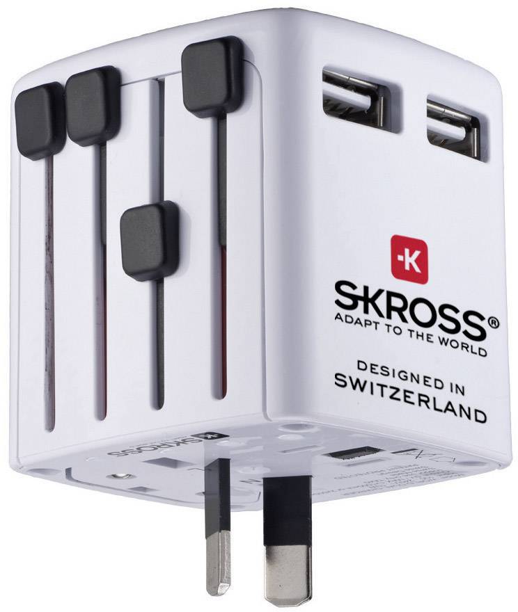 A white travel adapter with multiple USB ports and retractable plugs for different countries; Designed in Switzerland.