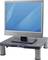A flat-screen monitor sits on an elevated stand. The screen displays a blue, abstract background without specific details.