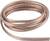 A coil of copper wire lies on a white background. The wire is shiny and wound in a spiral shape.