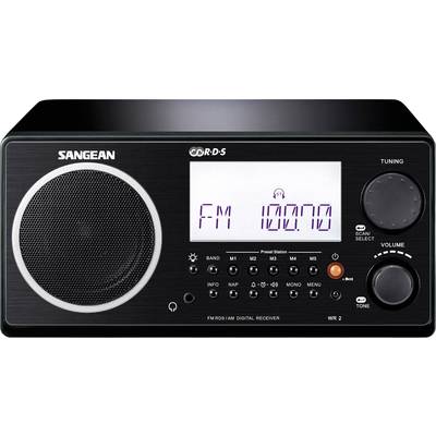 Black radio with speaker on the left, display on the right showing 'FM 100.00', with buttons for functions and a volume control dial underneath.