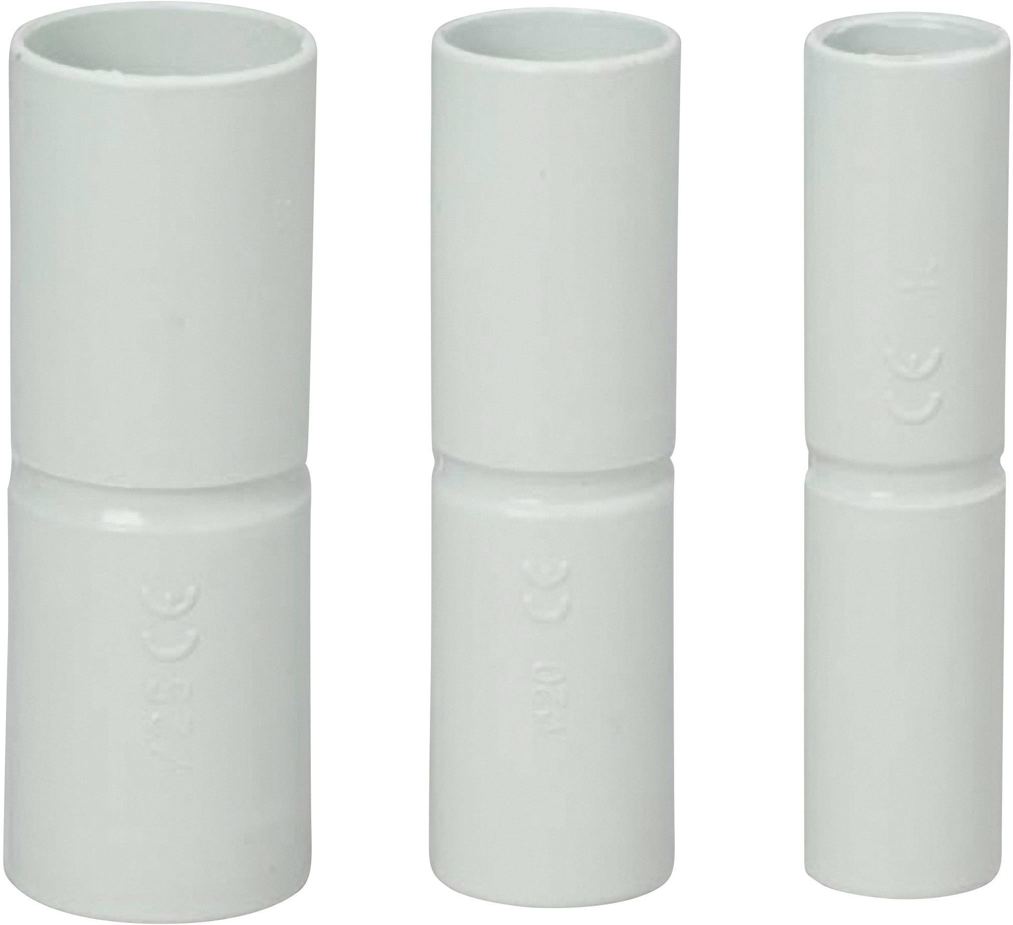 Three white PVC pipe couplings of different sizes are positioned side by side. They are cylindrical and have a smooth surface.