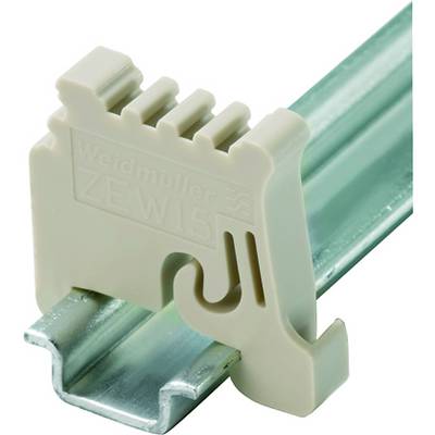 'Weidmüller ZEW15' terminal block mounted on metal rail. Beige plastic terminal block with live rail visible underneath.