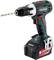 Cordless drill with drill bit, Metabo brand, 18 V, black and green housing, standing upright with battery attached.