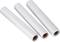 Three white plastic reels are lying side by side on a light background.