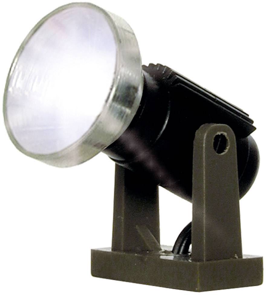 A black halogen spotlight with a silver rim mounted on a brown stand, slightly tilted upwards.