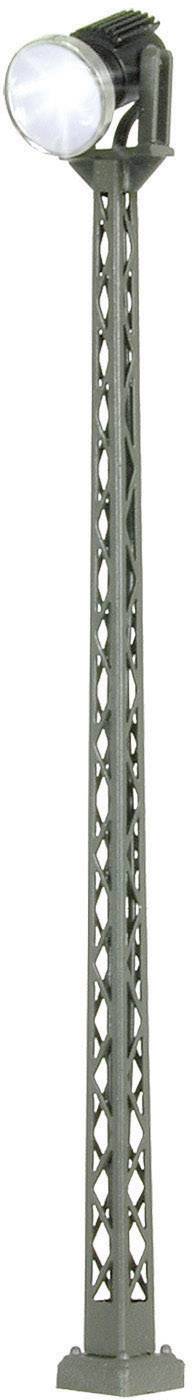 A tall, grey tower with a round, luminous beacon at its summit.