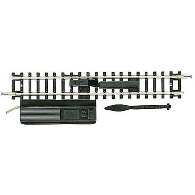 Model railway track with point and electric switch for changing direction. Mechanisms are visible.