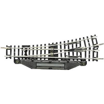 Railway points with tracks branching in two directions. Model railway accessory in authentic reproduction.