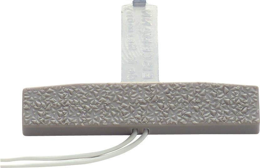 A grey, rectangular device with a textured surface and two protruding cables.