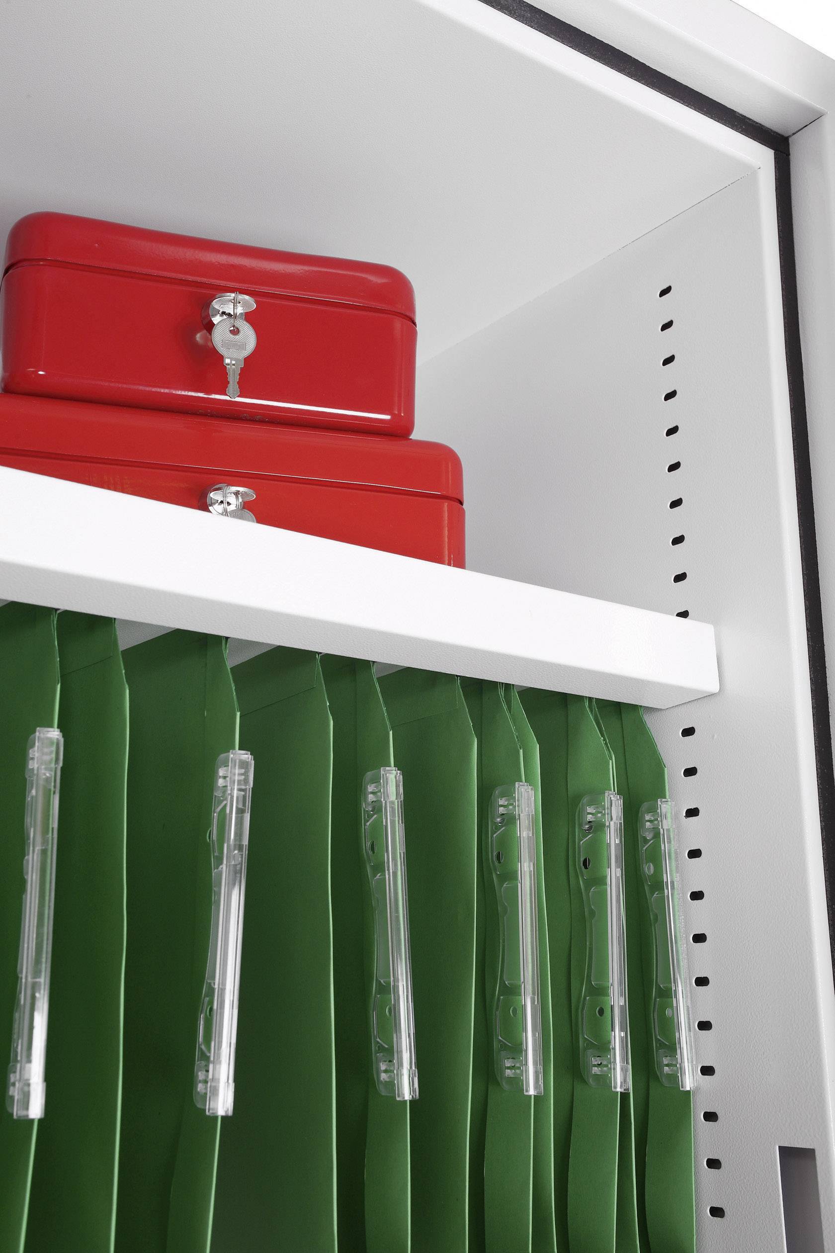 A white shelving unit with a red metal box on the top shelf and several green hanging files underneath.