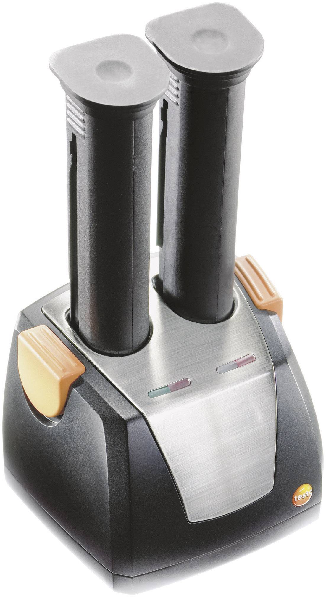 A charger with two black, upright batteries and orange buttons on the sides.