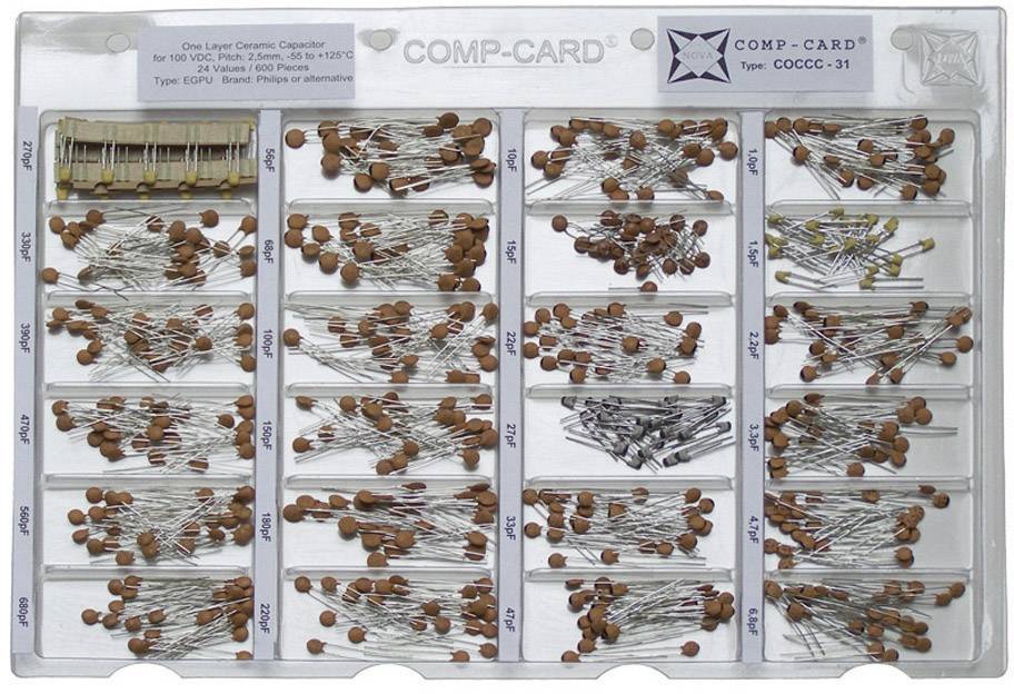 A selection of ceramic capacitors in a transparent plastic organiser, with various capacitances arranged in separate compartments.