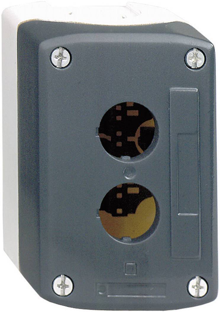 A grey, rectangular housing front with two round openings in the centre, surrounded by four screws in the corners.